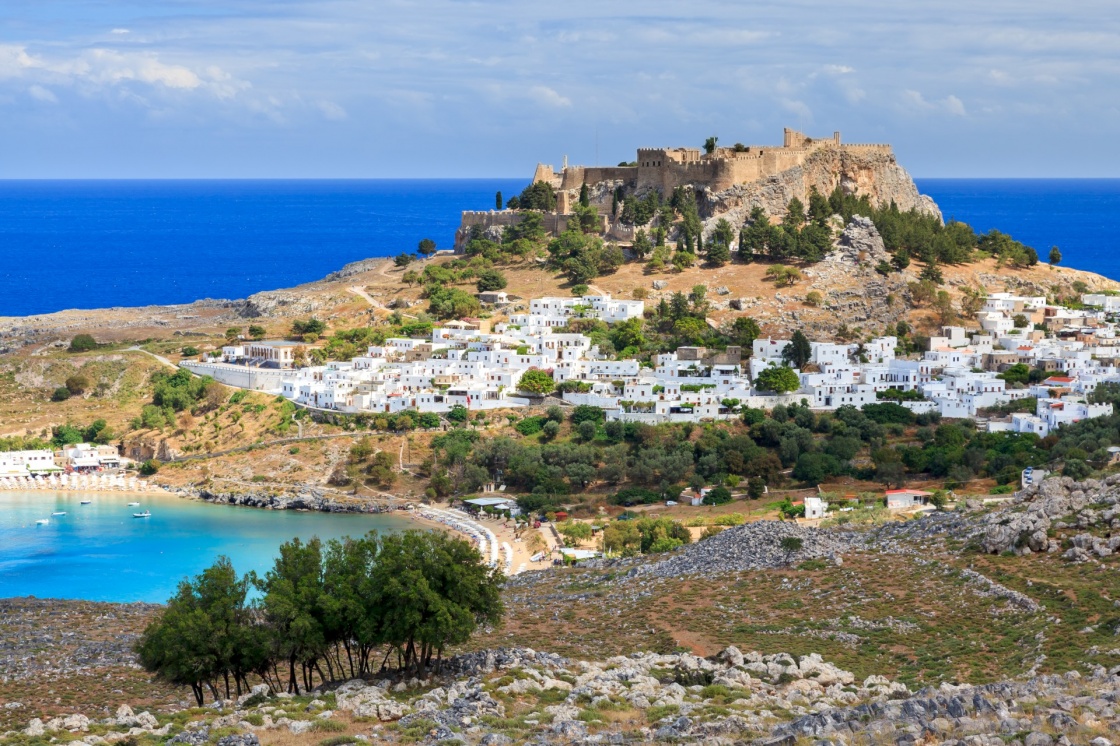 'View from the road down to the popular town of Lindos on the Island of Rhodes Greece' - Родос